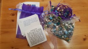 Gift bag with beads for creating a bracelet